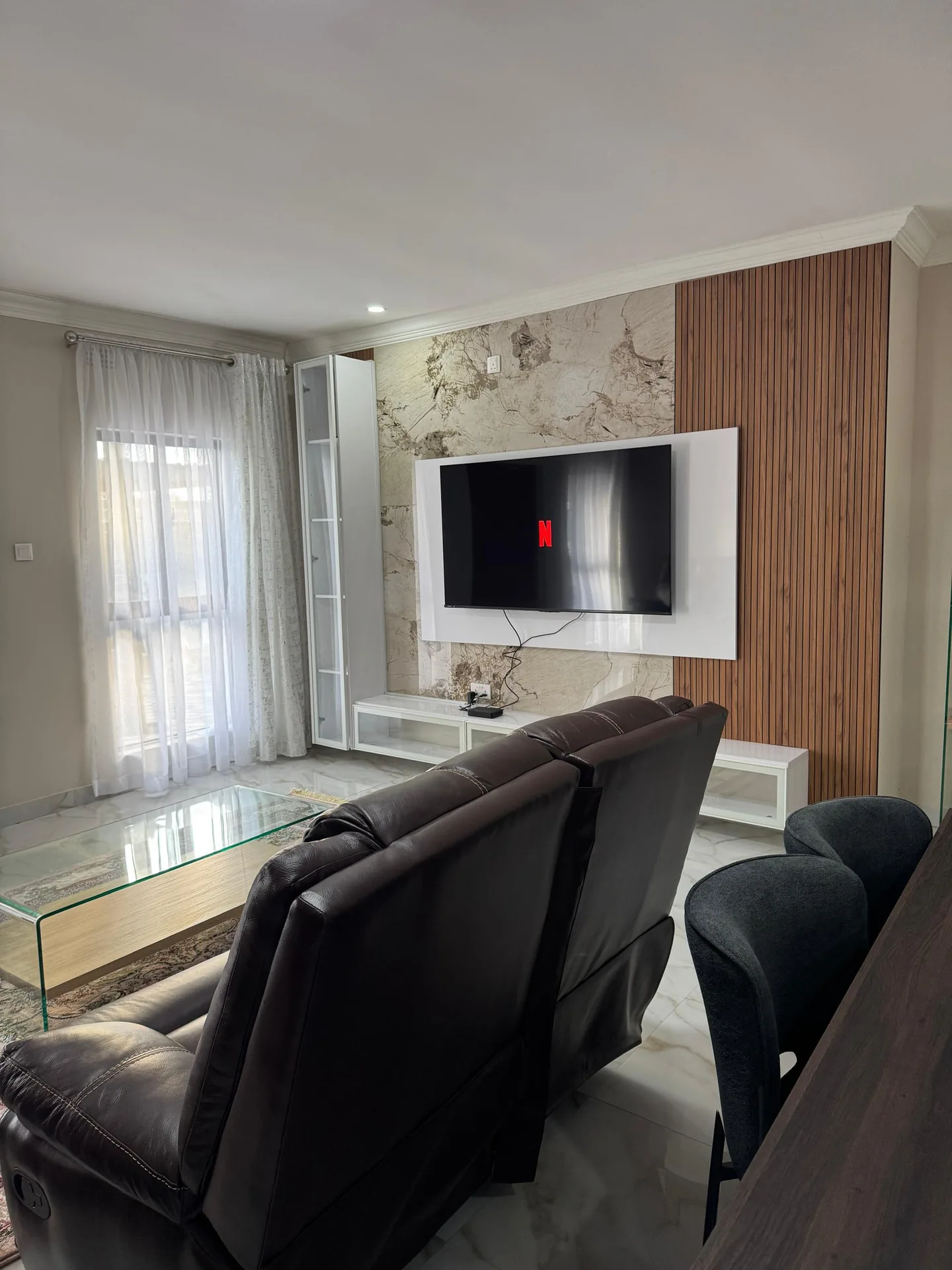Living room seating with wall-mounted TV
