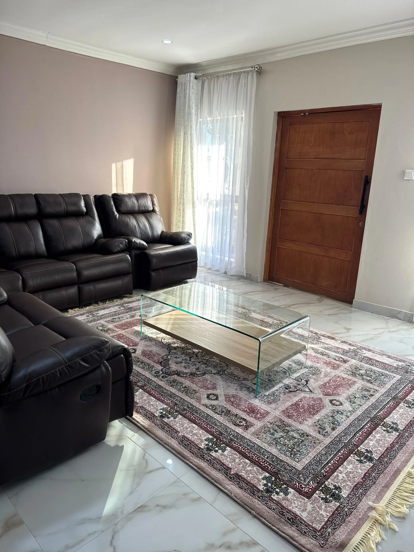 Living area with smart TV and rug